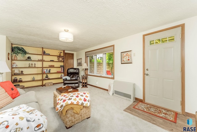 3112 E 15th St, Sioux Falls, SD 57103 - carpeted living area with a textured ceiling and heating unit