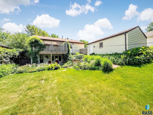 3112 E 15th St, Sioux Falls, SD 57103 - rear view of house featuring a yard and a wooden deck