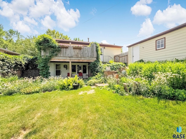 3112 E 15th St, Sioux Falls, SD 57103 - rear view of house featuring a yard and a deck