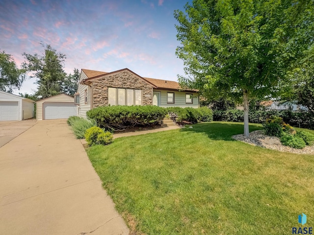3112 E 15th St, Sioux Falls, SD 57103 - ranch-style house with stone siding, a detached garage, an outdoor structure, and a front yard
