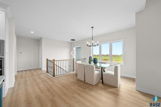 5601 E Morningside Cir, Sioux Falls, SD 57110 - dining room featuring light wood-style flooring, recessed lighting, and a chandelier