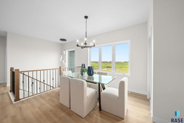 5601 E Morningside Cir, Sioux Falls, SD 57110 - dining area featuring light wood-style floors and a chandelier