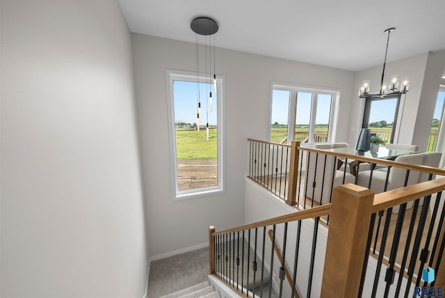 5601 E Morningside Cir, Sioux Falls, SD 57110 - stairs with carpet flooring and a chandelier