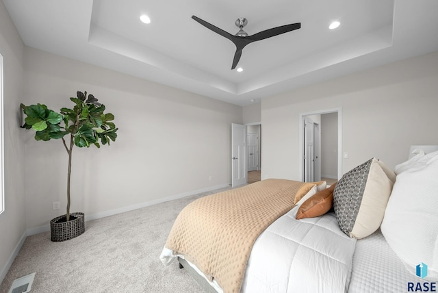 5601 E Morningside Cir, Sioux Falls, SD 57110 - bedroom with a raised ceiling, recessed lighting, carpet floors, and ceiling fan