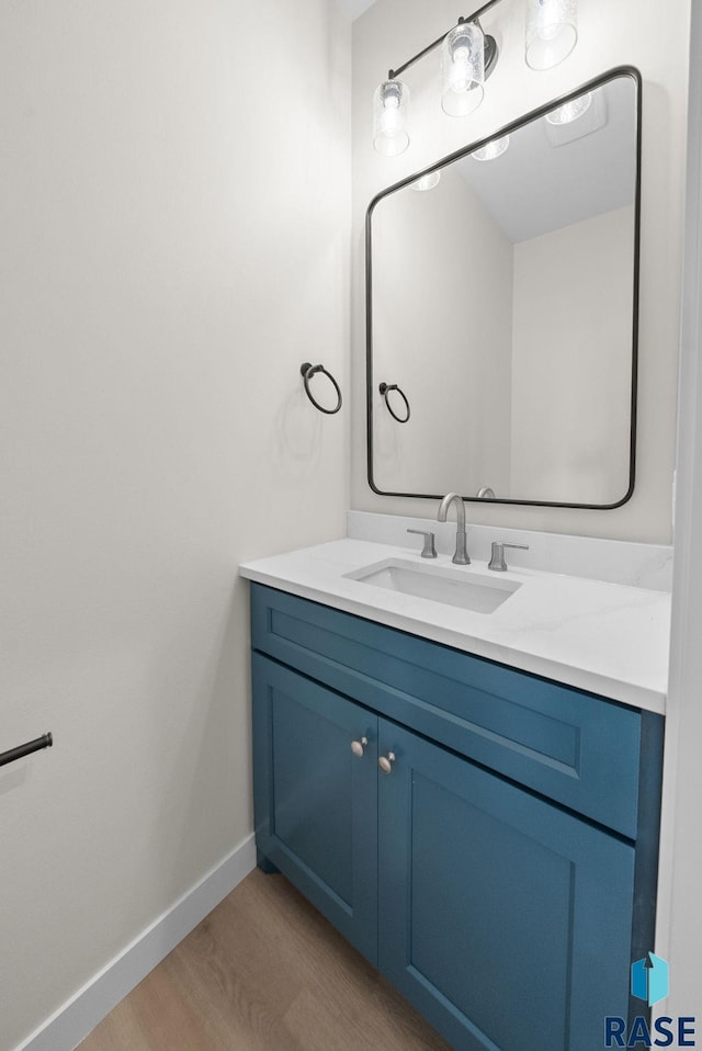 5601 E Morningside Cir, Sioux Falls, SD 57110 - bathroom featuring wood finished floors and vanity