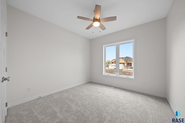 5601 E Morningside Cir, Sioux Falls, SD 57110 - carpeted spare room with baseboards and a ceiling fan
