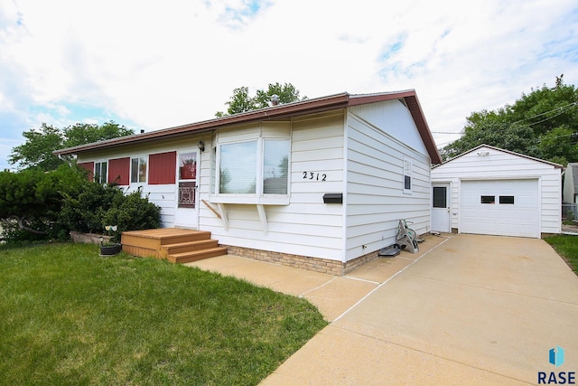 2312 E 19th St, Sioux Falls, SD 57103 - single story home featuring a garage, an outbuilding, a front yard, and driveway