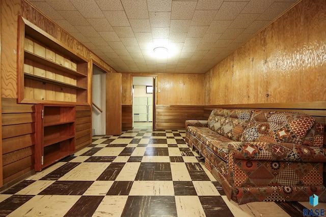 2312 E 19th St, Sioux Falls, SD 57103 - living area with wood walls, tile patterned floors, and stairway