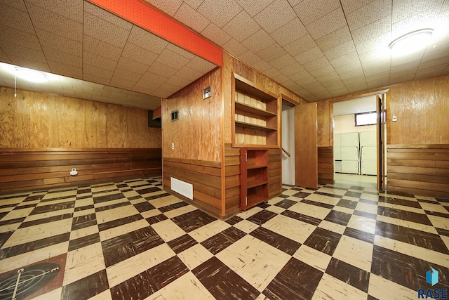 2312 E 19th St, Sioux Falls, SD 57103 - finished basement with wood walls and tile patterned floors