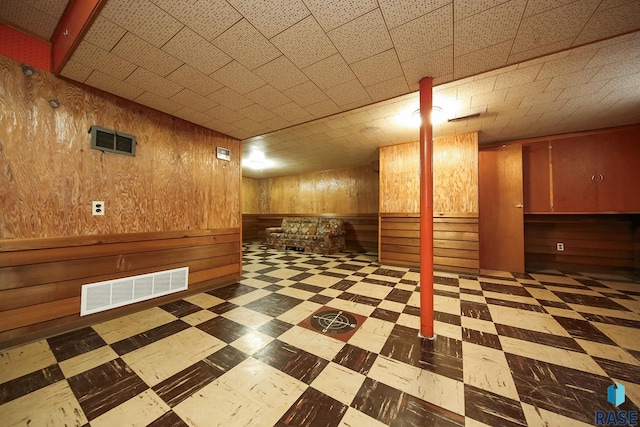 2312 E 19th St, Sioux Falls, SD 57103 - finished below grade area with tile patterned floors and wooden walls
