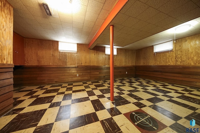 2312 E 19th St, Sioux Falls, SD 57103 - below grade area with tile patterned floors and wooden walls
