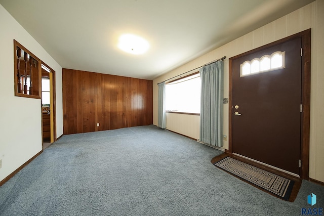 2312 E 19th St, Sioux Falls, SD 57103 - foyer featuring carpet and wooden walls