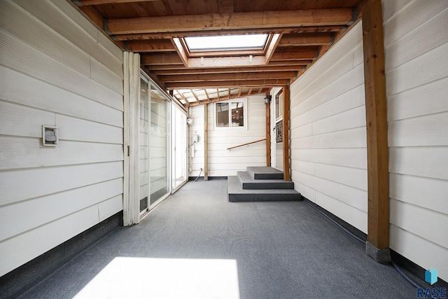 2312 E 19th St, Sioux Falls, SD 57103 - basement featuring wooden walls and carpet