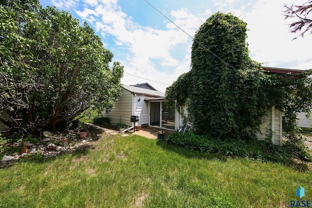 2312 E 19th St, Sioux Falls, SD 57103 - back of house featuring a yard and a sunroom