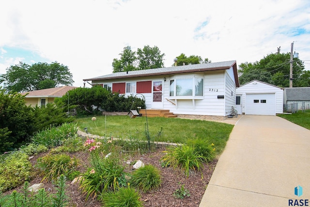 2312 E 19th St, Sioux Falls, SD 57103 - view of front of home featuring an outbuilding, concrete driveway, entry steps, a front yard, and a garage