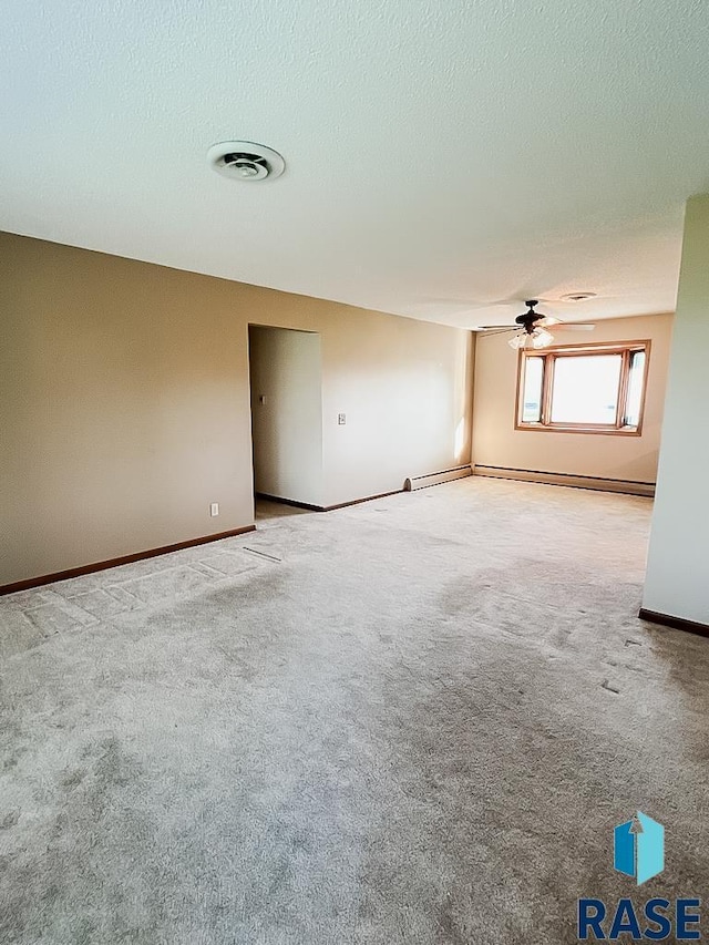 515 151st St, Luverne, MN 56156 - empty room featuring carpet floors, a ceiling fan, and a textured ceiling