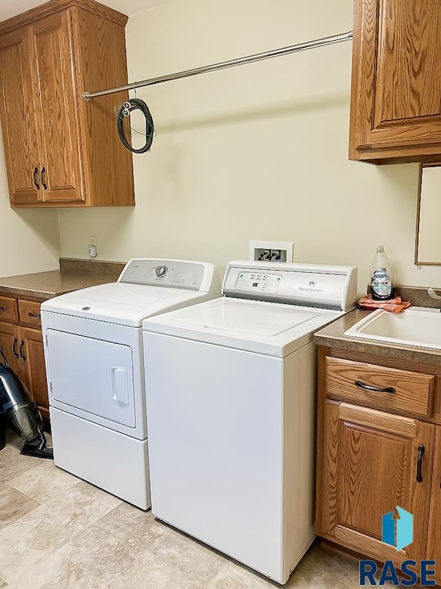 515 151st St, Luverne, MN 56156 - laundry room with washing machine and clothes dryer and cabinet space