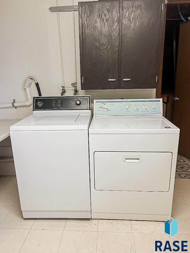 515 151st St, Luverne, MN 56156 - laundry room with washing machine and clothes dryer and cabinet space