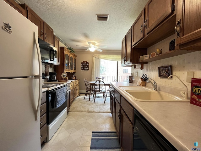 3552 S Gateway Blvd Unit 204, Sioux Falls, SD 57106 - kitchen with black appliances, open shelves, light countertops, a ceiling fan, and a textured ceiling