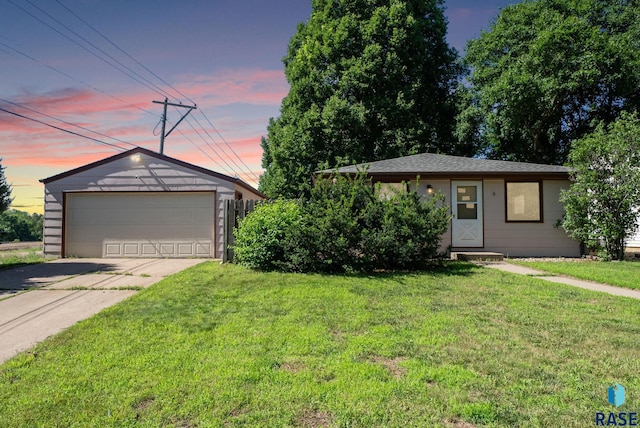 1615 E 32nd St, Sioux Falls, SD 57105 - ranch-style home with a detached garage, a front lawn, and an outbuilding
