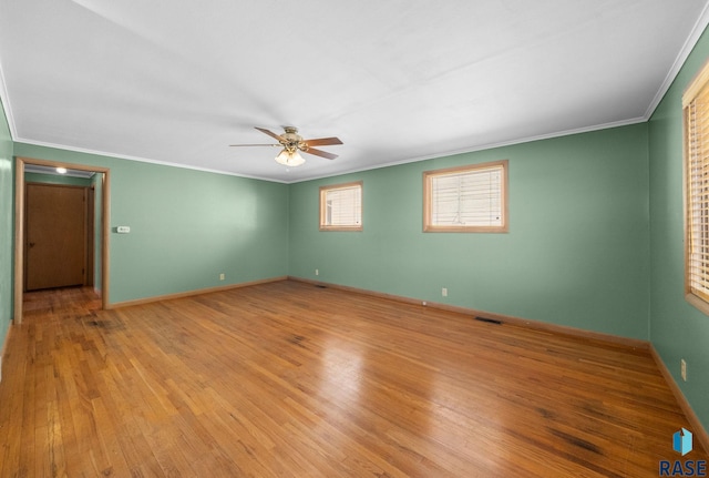 1615 E 32nd St, Sioux Falls, SD 57105 - unfurnished room featuring crown molding, a ceiling fan, and light wood-style floors