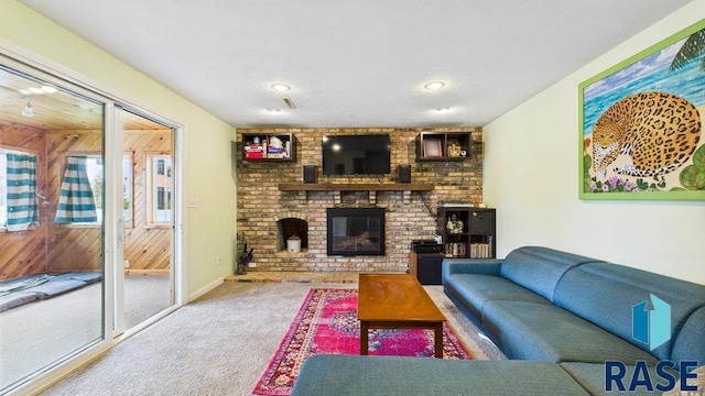 5004 W 34th St, Sioux Falls, SD 57106 - carpeted living room featuring a brick fireplace and wooden walls