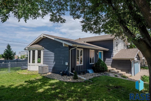 5004 W 34th St, Sioux Falls, SD 57106 - view of property exterior featuring board and batten siding and a garage
