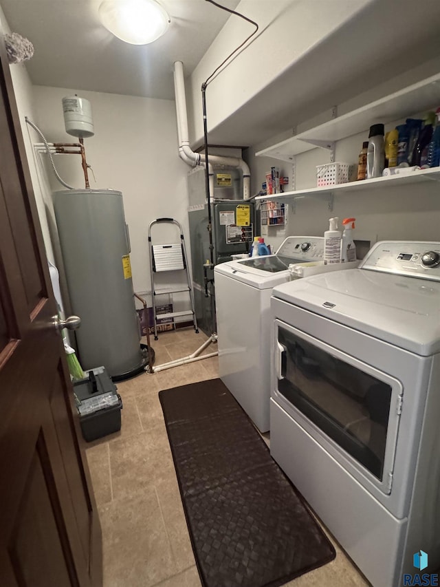 6509 S Tomar Rd Unit 3, Sioux Falls, SD 57108 - washroom with washing machine and clothes dryer, water heater, and light tile patterned floors