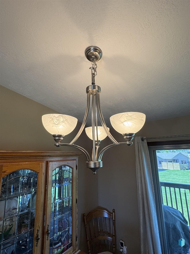 6509 S Tomar Rd Unit 3, Sioux Falls, SD 57108 - detailed view of a textured ceiling and a chandelier