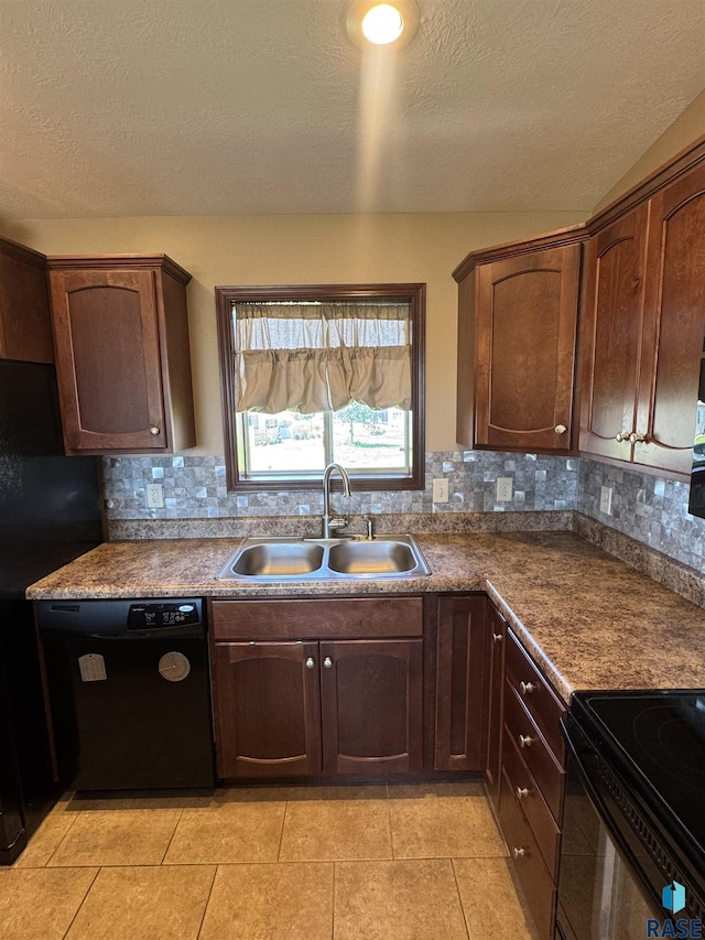 6509 S Tomar Rd Unit 3, Sioux Falls, SD 57108 - kitchen featuring dishwasher, a textured ceiling, tasteful backsplash, light tile patterned flooring, and dark countertops