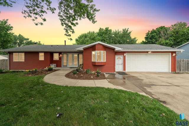 121 S 5th Ave, Brandon, SD 57005 - ranch-style house with a garage, driveway, and french doors