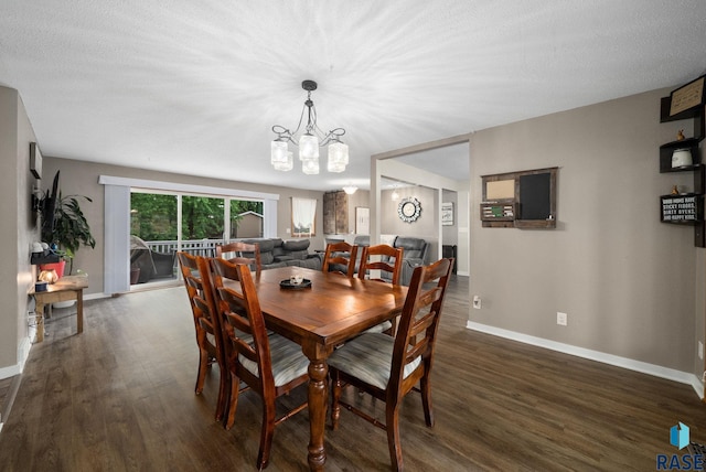 121 S 5th Ave, Brandon, SD 57005 - dining room with dark wood-type flooring, a chandelier, and a textured ceiling