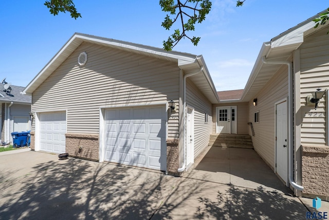 1418 E Redwood Blvd, Brandon, SD 57005 - view of side of property featuring driveway and a garage
