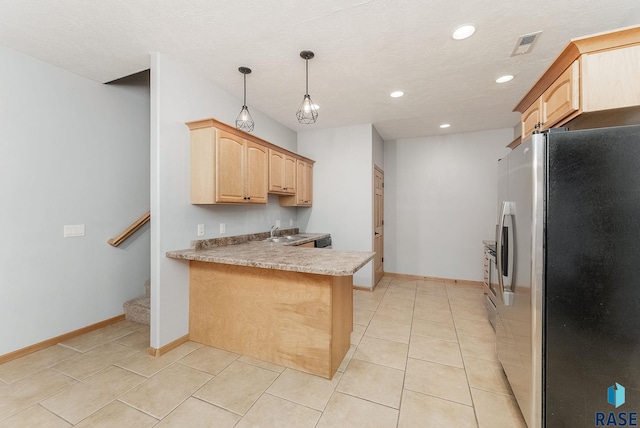 635 E Brian St, Tea, SD 57064 - kitchen featuring stainless steel fridge with ice dispenser, light brown cabinetry, a peninsula, recessed lighting, and light countertops