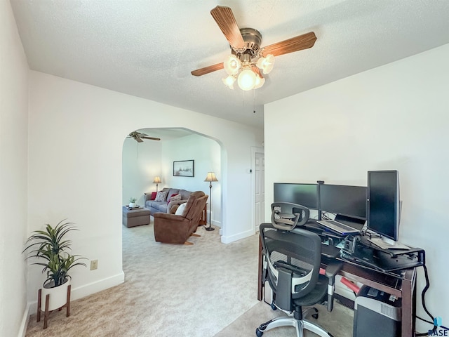 918 W 5th St, Sioux Falls, SD 57104 - carpeted home office featuring arched walkways, ceiling fan, and a textured ceiling