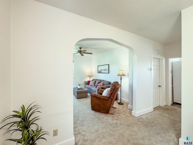 918 W 5th St, Sioux Falls, SD 57104 - living area featuring arched walkways, carpet, and a ceiling fan