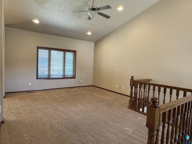 3908 W 89th St, Sioux Falls, SD 57108 - carpeted spare room with a ceiling fan, vaulted ceiling, and recessed lighting
