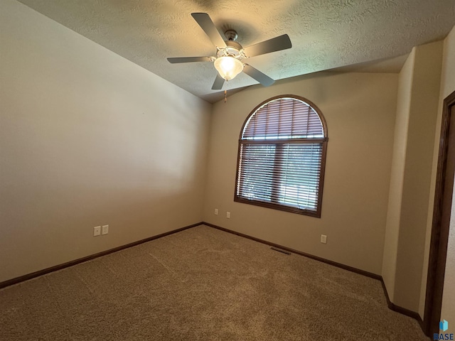 3908 W 89th St, Sioux Falls, SD 57108 - spare room with a textured ceiling, carpet flooring, and ceiling fan