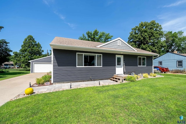 417 S Elm St, Lennox, SD 57039 - view of front of property with a front lawn, a garage, and a shingled roof