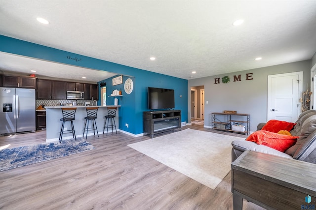 417 S Elm St, Lennox, SD 57039 - living room featuring recessed lighting and light wood-style floors