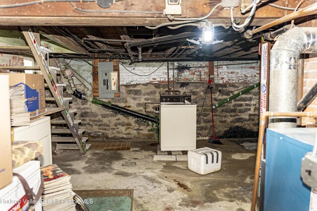 53 Broad St, Catskill, NY 12414 - unfinished below grade area with electric panel and washer / clothes dryer