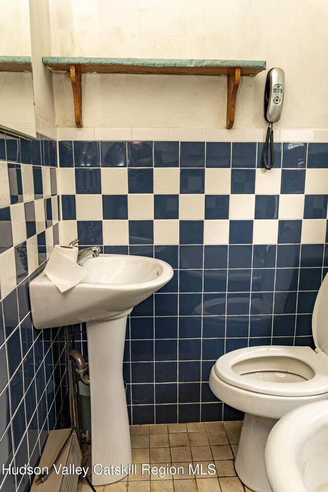 53 Broad St, Catskill, NY 12414 - half bath featuring tile walls and tile patterned flooring