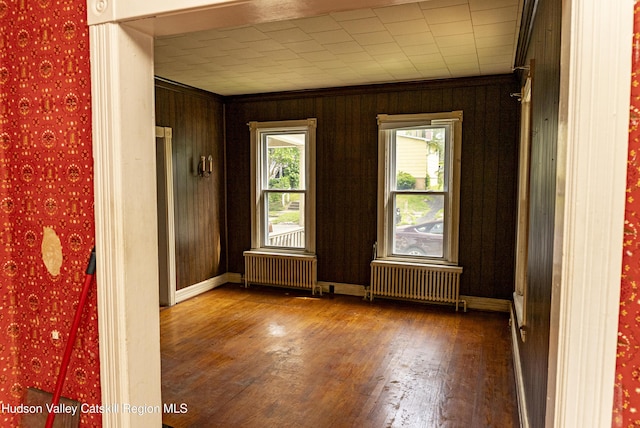 53 Broad St, Catskill, NY 12414 - unfurnished room featuring radiator, wood finished floors, and crown molding