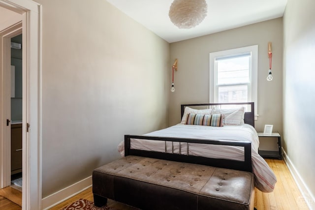 705 Warren St, Hudson, NY 12534 - bedroom with light wood-style flooring and baseboards