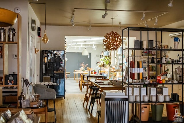 705 Warren St, Hudson, NY 12534 - dining space featuring wood-type flooring and track lighting
