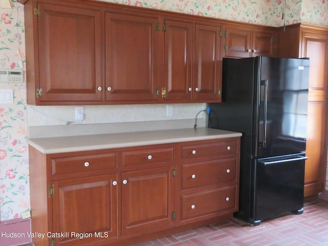 kitchen with black refrigerator