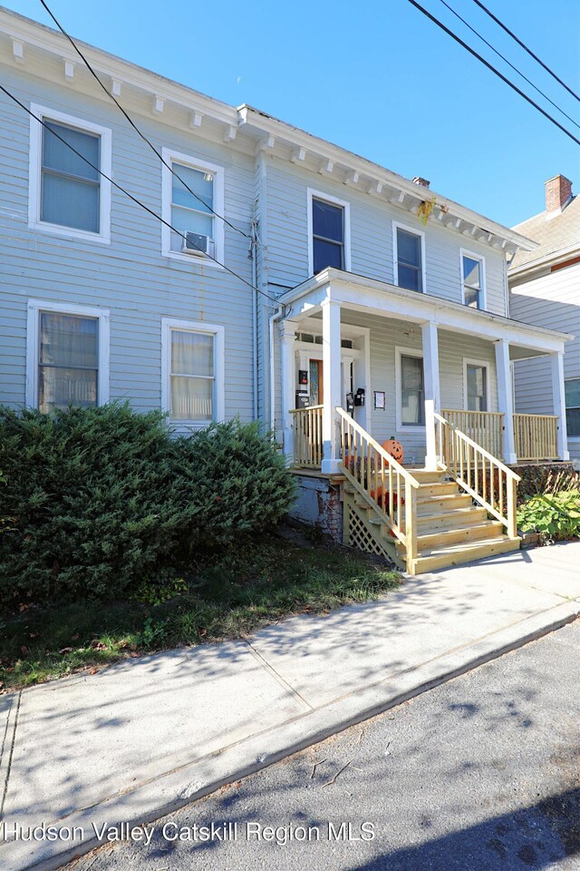 view of property with covered porch