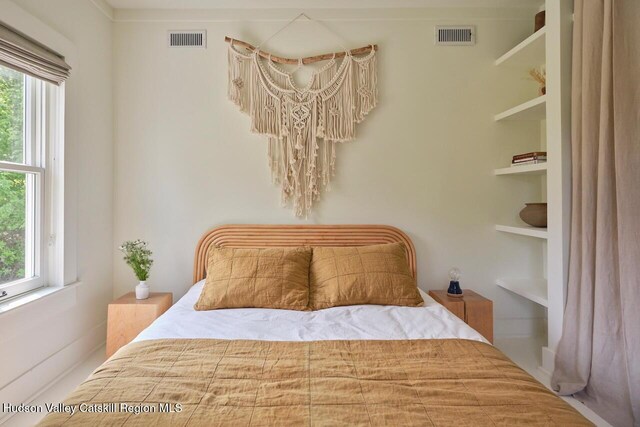 1556 Gulf Rd, Callicoon Center, NY 12724 - bedroom with multiple windows and a chandelier