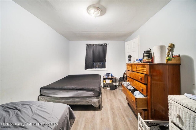 bedroom featuring wood finished floors