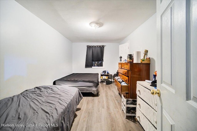 bedroom featuring wood finished floors